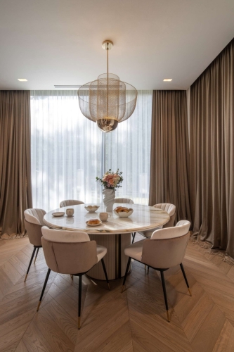 Luxurious curtains in the dining room of a modern apartment in Prague