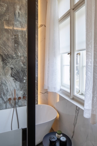 Roller blinds by Bematech in a luxurious Prague bathroom